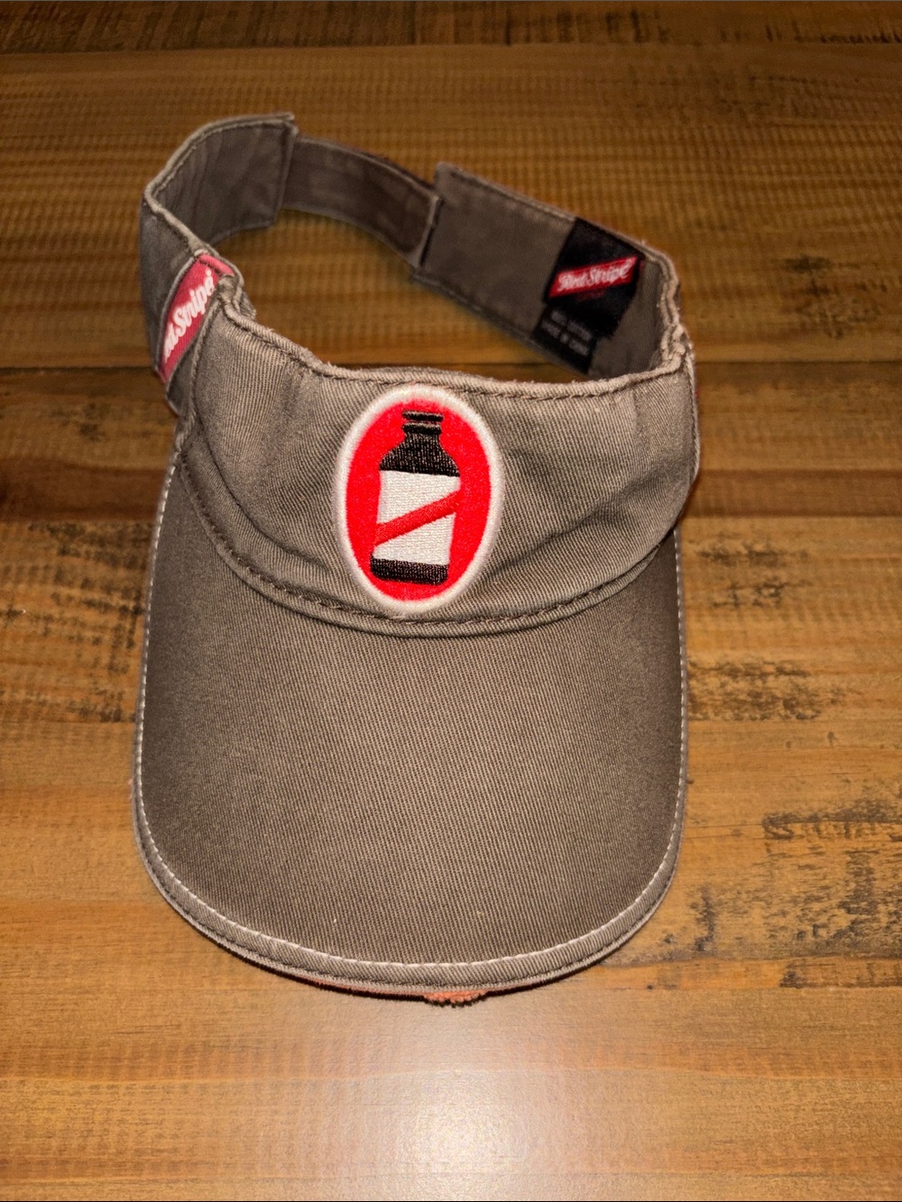 Red Stripe Brown Visor with Red Bottle Patch brown & red like new